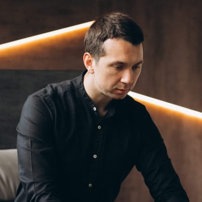 Handsome business man working on computer in office